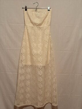 Bohemian-style lace strapless maxi dress featuring a floral crochet patterns